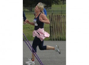 Picture of woman crossing the finish line-she did it!